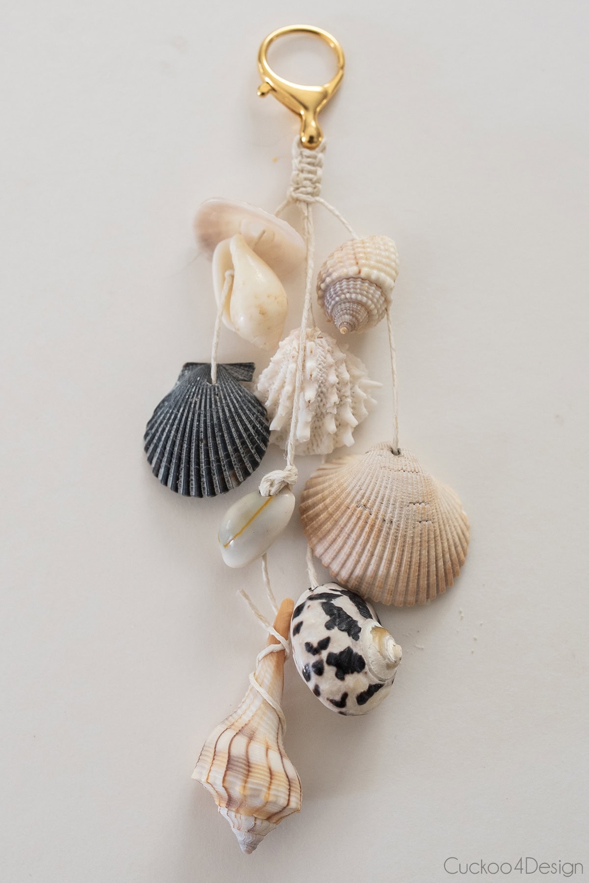 close-up of finished zipper pull charm with seashells