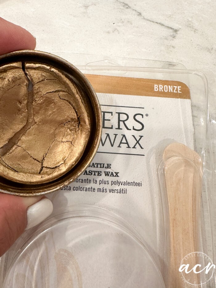 open tin of bronze paste