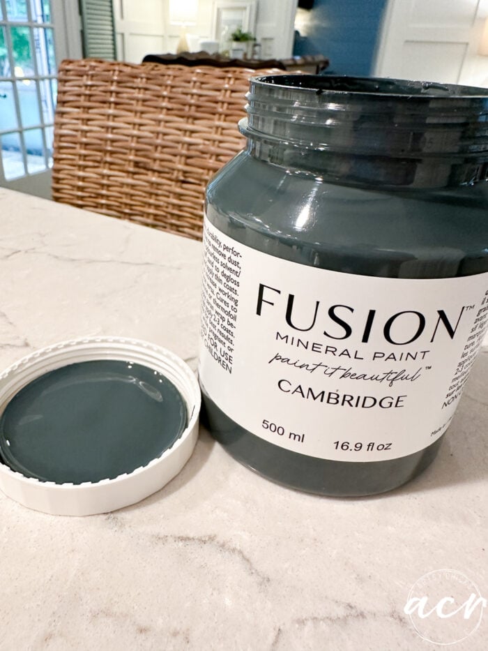 jar of blue paint on counter 