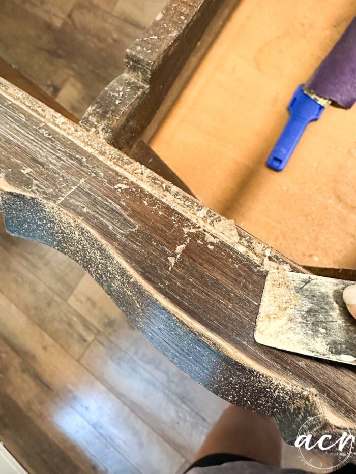 scraping loose finish with putty knife