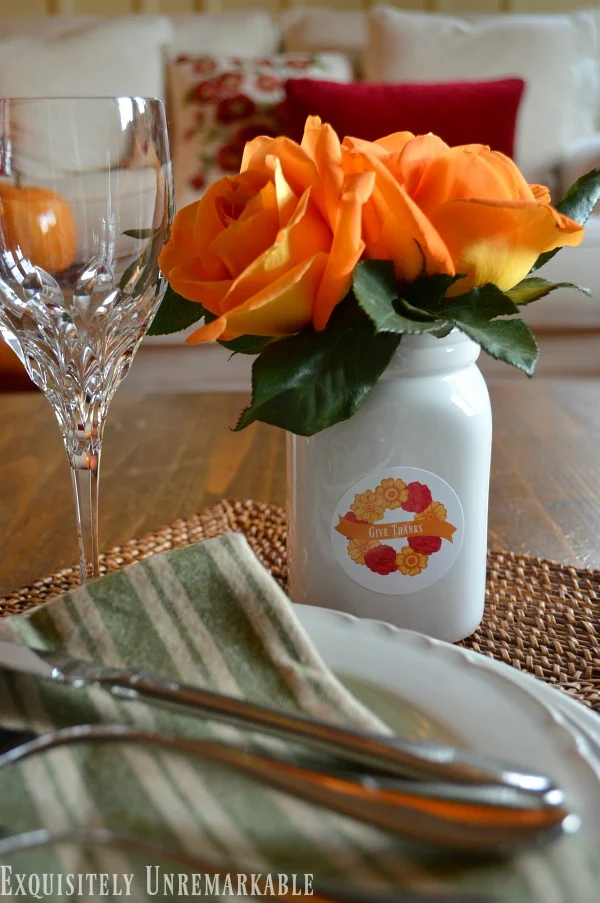 Decorating With Custon DIY Stickers Decorated mason jar with orange flowers on holiday table setting
